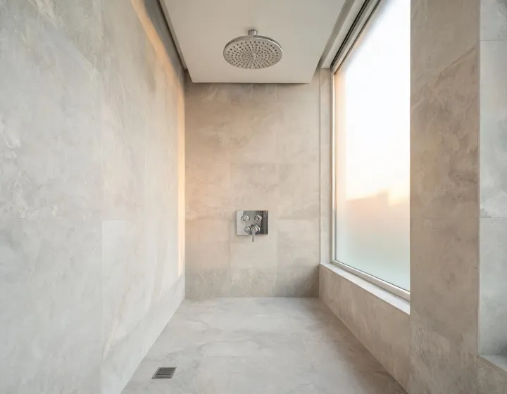 Luxury hotel bathroom with Grohe rain shower and chrome fixtures