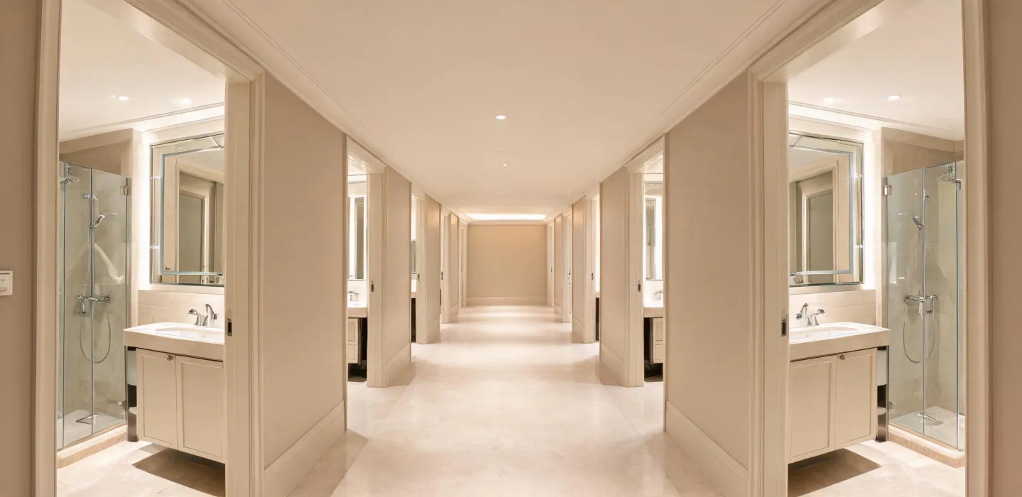 Hospitality bathroom corridor with consistent fixture packages